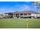 Clubhouse with golf course and putting green at 5950 Pelican Bay S Plz # Ph-2D, St Petersburg, FL 33707