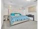 Spacious bedroom with king-size bed and stylish decor at 7353 Wash Island Dr, Sun City Center, FL 33573