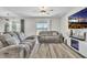 Living room with gray couches and a view of the backyard at 7353 Wash Island Dr, Sun City Center, FL 33573