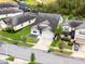 Aerial view showing house, landscaping, and neighborhood at 7465 Yale Harbor Dr, Wesley Chapel, FL 33545