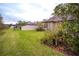 Landscaped backyard with grassy area and privacy fence at 7465 Yale Harbor Dr, Wesley Chapel, FL 33545