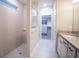 Bathroom with walk-in shower, tile flooring, and a large closet at 7465 Yale Harbor Dr, Wesley Chapel, FL 33545