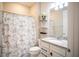 Clean bathroom with granite countertop and shower at 7465 Yale Harbor Dr, Wesley Chapel, FL 33545