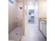 Spa-like bathroom with a walk-in shower and a separate vanity area at 7465 Yale Harbor Dr, Wesley Chapel, FL 33545