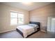 Spacious bedroom with large window, window blinds, and modern decor at 7465 Yale Harbor Dr, Wesley Chapel, FL 33545