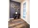 Stylish entryway with modern decor and wood floors at 7465 Yale Harbor Dr, Wesley Chapel, FL 33545