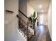 Bright and spacious entryway with hardwood floors and a staircase at 7465 Yale Harbor Dr, Wesley Chapel, FL 33545