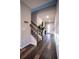 Spacious entryway with wood-look floors and a staircase at 7465 Yale Harbor Dr, Wesley Chapel, FL 33545