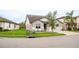 Two-story house with gray siding, white accents, and a two-car garage at 7465 Yale Harbor Dr, Wesley Chapel, FL 33545