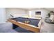 Game room with pool table and sectional sofa at 7465 Yale Harbor Dr, Wesley Chapel, FL 33545