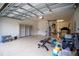 Spacious garage with built-in shelving and room for a home gym at 7465 Yale Harbor Dr, Wesley Chapel, FL 33545