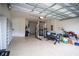 Spacious garage with built-in shelving and room for a home gym at 7465 Yale Harbor Dr, Wesley Chapel, FL 33545