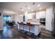 Modern kitchen with a large island and hardwood floors at 7465 Yale Harbor Dr, Wesley Chapel, FL 33545