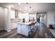 Modern kitchen with white cabinets, granite island, and stainless steel appliances at 7465 Yale Harbor Dr, Wesley Chapel, FL 33545