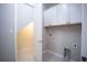 Laundry room features a washer, dryer, and extra storage at 7465 Yale Harbor Dr, Wesley Chapel, FL 33545