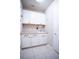 Well-equipped laundry room with cabinets and countertop at 7465 Yale Harbor Dr, Wesley Chapel, FL 33545