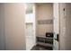 Bright laundry room with white cabinets and built-in storage at 7465 Yale Harbor Dr, Wesley Chapel, FL 33545