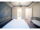 Large main bedroom with a ceiling fan and en-suite bathroom at 7465 Yale Harbor Dr, Wesley Chapel, FL 33545