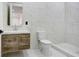 Modern bathroom with floating vanity and marble tile at 7818 N Hubert Ave, Tampa, FL 33614