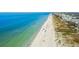 Aerial view of beach with people enjoying the sun at 1000 Gulf Blvd # 302, Indian Rocks Beach, FL 33785