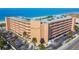 Aerial view of Reef Club 1000, a beachfront building with ocean views and ample parking at 1000 Gulf Blvd # 302, Indian Rocks Beach, FL 33785