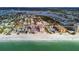 Wide aerial showcasing building, beach, ocean and surroundings at 1000 Gulf Blvd # 302, Indian Rocks Beach, FL 33785