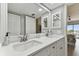 Double vanity bathroom with updated finishes at 1000 Gulf Blvd # 302, Indian Rocks Beach, FL 33785