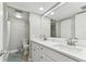 Double vanity bathroom with updated white cabinets at 1000 Gulf Blvd # 302, Indian Rocks Beach, FL 33785