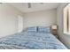 Bedroom with a queen bed, light grey walls, and ceiling fan at 1000 Gulf Blvd # 302, Indian Rocks Beach, FL 33785