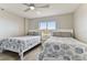 Bedroom with two twin beds, ceiling fan, and ocean view at 1000 Gulf Blvd # 302, Indian Rocks Beach, FL 33785