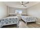 Bedroom with two twin beds, ceiling fan, and ocean view at 1000 Gulf Blvd # 302, Indian Rocks Beach, FL 33785