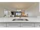 Kitchen with stainless steel sink and white cabinets at 1000 Gulf Blvd # 302, Indian Rocks Beach, FL 33785