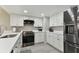 Modern kitchen with white cabinets, stainless steel appliances, and quartz countertops at 1000 Gulf Blvd # 302, Indian Rocks Beach, FL 33785