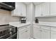 Kitchen with stainless steel appliances and white cabinets at 1000 Gulf Blvd # 302, Indian Rocks Beach, FL 33785