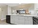 Modern kitchen with white cabinets and quartz countertops at 1000 Gulf Blvd # 302, Indian Rocks Beach, FL 33785