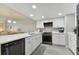 Modern kitchen with white cabinets, quartz countertops and stainless steel appliances at 1000 Gulf Blvd # 302, Indian Rocks Beach, FL 33785
