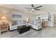 Living room with light flooring and access to balcony at 1000 Gulf Blvd # 302, Indian Rocks Beach, FL 33785