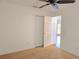 A light filled standard bedroom features an opened closet to a hallway at 10232 Oakhurst Rd, Largo, FL 33774