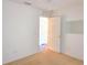 A standard bedroom with carpet and neutral walls showcasing an open closet at 10232 Oakhurst Rd, Largo, FL 33774