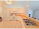Well-lit kitchen with white appliances and cabinets at 10232 Oakhurst Rd, Largo, FL 33774