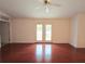 Expansive living area features hardwood floors and french doors with lots of natural light at 10232 Oakhurst Rd, Largo, FL 33774