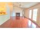Open concept floor plan with fireplace and hardwood floors at 10232 Oakhurst Rd, Largo, FL 33774