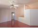 Open living area with ceiling fan and wood flooring at 10232 Oakhurst Rd, Largo, FL 33774