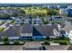 Aerial view of community showing multiple townhomes near a golf course at 1050 Starkey Rd # 704, Largo, FL 33771