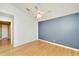 Bright bedroom with hardwood floors and neutral walls, offering a versatile space with natural light at 1050 Starkey Rd # 704, Largo, FL 33771