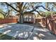 Large backyard with patio and a wooden fence at 1100 E Louisiana Ave, Tampa, FL 33603