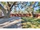 Backyard with wooden fence, gate, and grassy area at 1100 E Louisiana Ave, Tampa, FL 33603