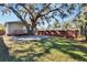 Large backyard with a patio and wooden fence at 1100 E Louisiana Ave, Tampa, FL 33603