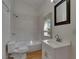 Clean bathroom with tile shower and vanity at 1100 E Louisiana Ave, Tampa, FL 33603