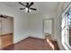 Well lit bedroom with hardwood floors and bathroom access at 1100 E Louisiana Ave, Tampa, FL 33603